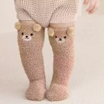 Beige kids knee-high winter socks with cute bear face.