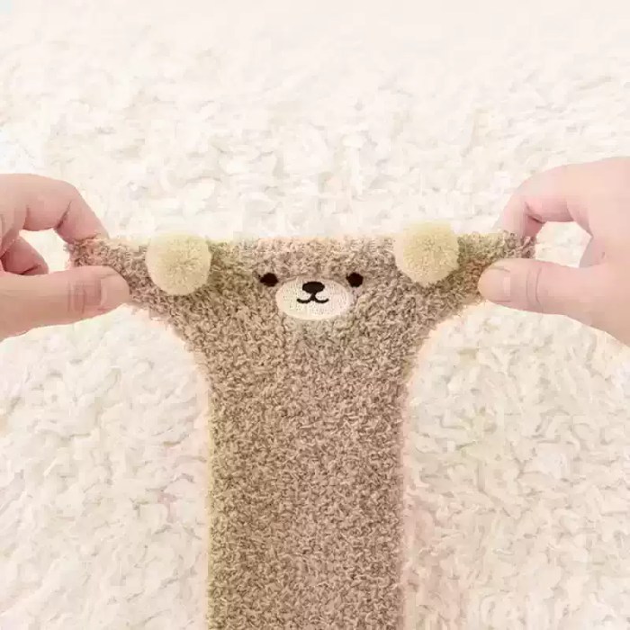 Stretchy beige kids bear socks with soft knitted fabric.